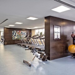 Отель Media Rotana Dubai фитнесс-зал фото 2