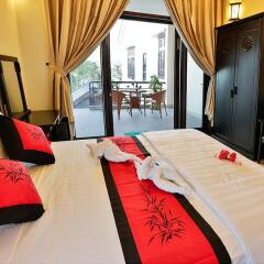 Отель Cam Chau Homestay Хойан комната для гостей