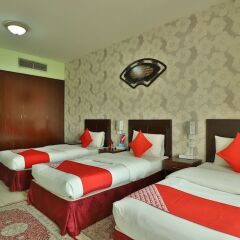 OYO 261 Remas Hotel Apartment Дубай комната для гостей фото 2
