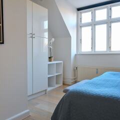 Апартаменты Super Cozy 3-bedroom Duplex Apartment in Frederiksberg Close to Copenhagen Zoo Фредериксберг комната для гостей фото 4