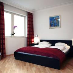 Апартаменты La Scala Apartments комната для гостей