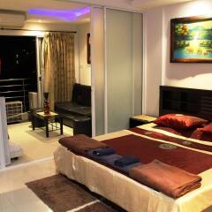 Апартаменты Wongamat Privacy By Good Luck Apartments Паттайя комната для гостей фото 4