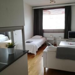 Апартаменты Kotimaailma Apartments Jyväskylä Ювяскюля комната для гостей фото 4