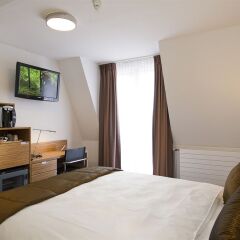 Отель Mercure Stoller Zurich Швейцария, Цюрих - 9 отзывов об отеле, цены и фото номеров - забронировать отель Mercure Stoller Zurich онлайн комната для гостей фото 5