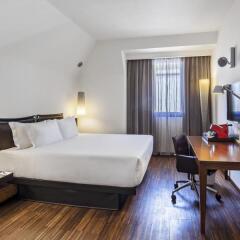 Отель NH Milano Touring 4* Улучшенный номер с различными типами кроватей фото 39