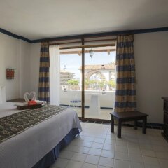 Отель Los Arcos Suites Пуэрто-Вальярта комната для гостей фото 3