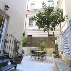Апартаменты Santi Quattro Apartment & Rooms - Colosseo интерьер отеля