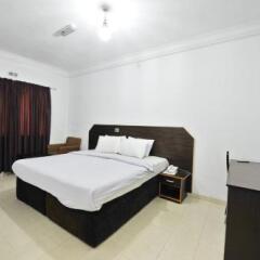 Отель The Bridgeview Hotel by Paullet Suites Нигерия, Варри - отзывы, цены и фото номеров - забронировать отель The Bridgeview Hotel by Paullet Suites онлайн комната для гостей