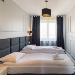 Отель Executive 3 Bedroom Apartament by Your F Польша, Варшава - отзывы, цены и фото номеров - забронировать отель Executive 3 Bedroom Apartament by Your F онлайн комната для гостей фото 3