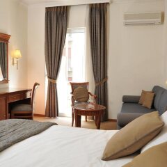 Отель Athens Atrium Hotel and Suites Греция, Афины - 2 отзыва об отеле, цены и фото номеров - забронировать отель Athens Atrium Hotel and Suites онлайн комната для гостей фото 5