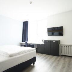 Отель carathotel Düsseldorf City комната для гостей