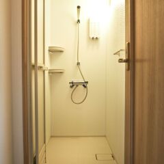 Отель Aso Base Backpackers Минамиогуни ванная