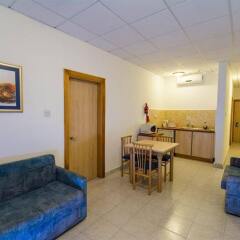 Отель Damiani Apartments Мальта, Буджибба - отзывы, цены и фото номеров - забронировать отель Damiani Apartments онлайн комната для гостей