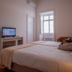 Отель CC Guest House - Ao Mercado Португалия, Понта-Делгада - отзывы, цены и фото номеров - забронировать отель CC Guest House - Ao Mercado онлайн комната для гостей фото 3