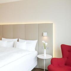 Отель NH Collection Frankfurt City 4* Улучшенный номер с различными типами кроватей фото 13