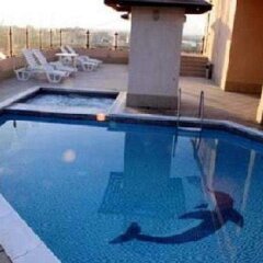 Отель Dolphin Hotel Apartments ОАЭ, Дубай - отзывы, цены и фото номеров - забронировать отель Dolphin Hotel Apartments онлайн бассейн