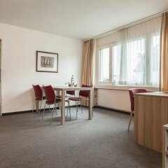 Апартаменты EMA house Serviced Apartments, Aussersihl Цюрих комната для гостей фото 3