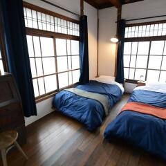 Taketa station hostel cue Минамиогуни комната для гостей фото 5