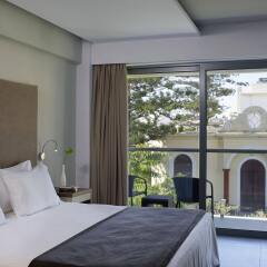 Отель Oktober Down Town Rooms Греция, Родос - отзывы, цены и фото номеров - забронировать отель Oktober Down Town Rooms онлайн комната для гостей
