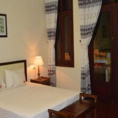 Отель Orchids Homestay сейф в номере