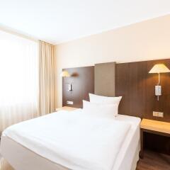 Отель NH Collection Berlin Mitte Am Checkpoint Charlie 4* Стандартный номер с разными типами кроватей фото 18