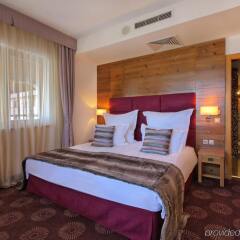 Отель Kempinski Hotel Grand Arena Болгария, Банско - 2 отзыва об отеле, цены и фото номеров - забронировать отель Kempinski Hotel Grand Arena онлайн комната для гостей фото 3