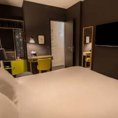 Отель Hôtel La Parizienne by Elegancia сейф в номере