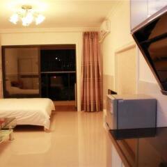 Апартаменты Xingfu Huafu Apartment в номере фото 2