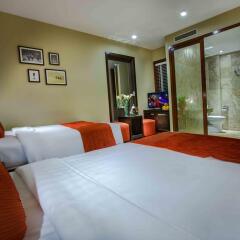 Отель Oriental Suites Ханой комната для гостей