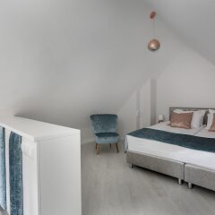 Апартаменты Lavoo Boutique Apartments комната для гостей