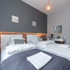 Апартаменты WarsawLiving - Cybernetyki Apartments комната для гостей фото 2