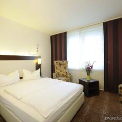 Отель Leonardo Hotel Munich City Olympiapark Германия, Мюнхен - 2 отзыва об отеле, цены и фото номеров - забронировать отель Leonardo Hotel Munich City Olympiapark онлайн комната для гостей фото 3