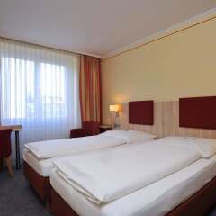 Hotel Concorde München Мюнхен комната для гостей фото 3