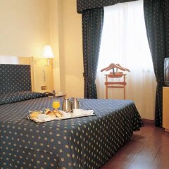 NH Suites Prisma Hotel в номере
