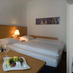 Отель ARCOTEL Castellani Salzburg в номере фото 2
