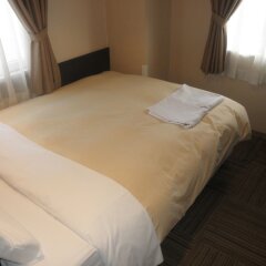 Отель Hospitality In Yawatajuku Камагая комната для гостей фото 5