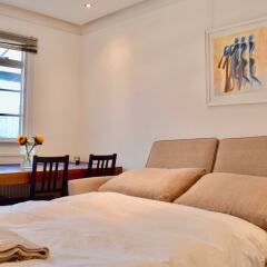 Апартаменты 2 Bedroom Apartment in Belsize Park Лондон комната для гостей фото 4