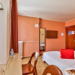 Отель Hôtel Terminus Paris La Défense сейф в номере