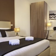 Отель Colonna Luxury Suites комната для гостей