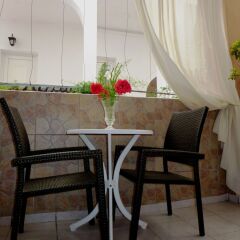 Отель Atalos Suites в номере