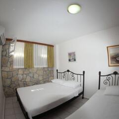 Отель Rüzgargülü Otel Бозджаада комната для гостей