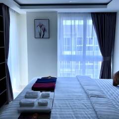 Апартаменты Luxury Apartments in Grand Avenue Паттайя комната для гостей фото 4