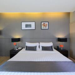 Отель At Mind Serviced Residence сейф в номере