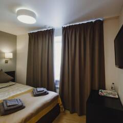 Мини-Отель Rooms & Breakfast Мурманск комната для гостей фото 4