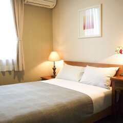 Отель Aso Base Backpackers Минамиогуни комната для гостей