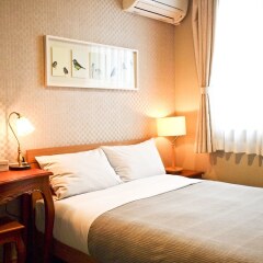Отель Aso Base Backpackers Минамиогуни комната для гостей фото 2