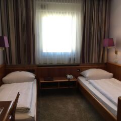 Hotel Hauser an der Universität комната для гостей