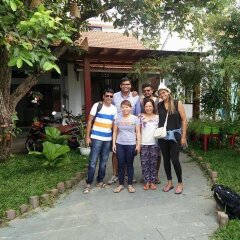 Отель Riverside Plum Garden Homestay