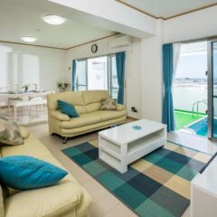 Отель Ocean View Condominium Томигусуку комната для гостей
