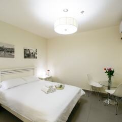 Отель Dizengoff Inn Тель-Авив комната для гостей фото 3